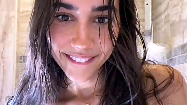 Sexy babe poses naked and plays with herself in the bathroom