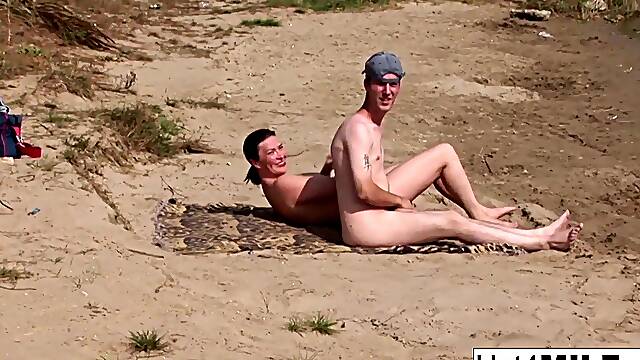 Busty MILF with natural tits fucks on the beach